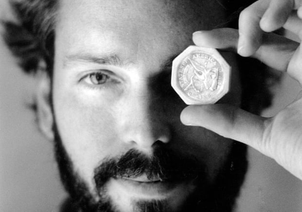 Tommy Thompson holds a $50 gold piece retrieved from the wreck of the gold ship SS Central America