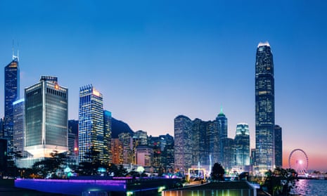 The iconic night view of the Central Business District in Hong Kong with contemporary skyscrapers along Victoria Harbour