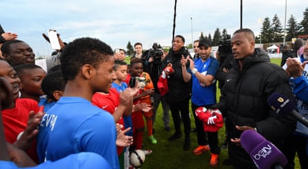 Patrice Evra with young players from Les Ulis, the club where he started his career, in 2016