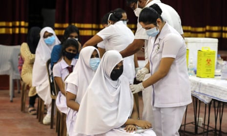Sri Lankan school students get the Pfizer/BioNTech vaccine in Colombo.