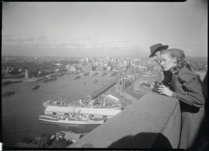 A couple take in the view of Sydney Harbour from the southern pylon lookout on the Harbour Bridge in the early 1950s