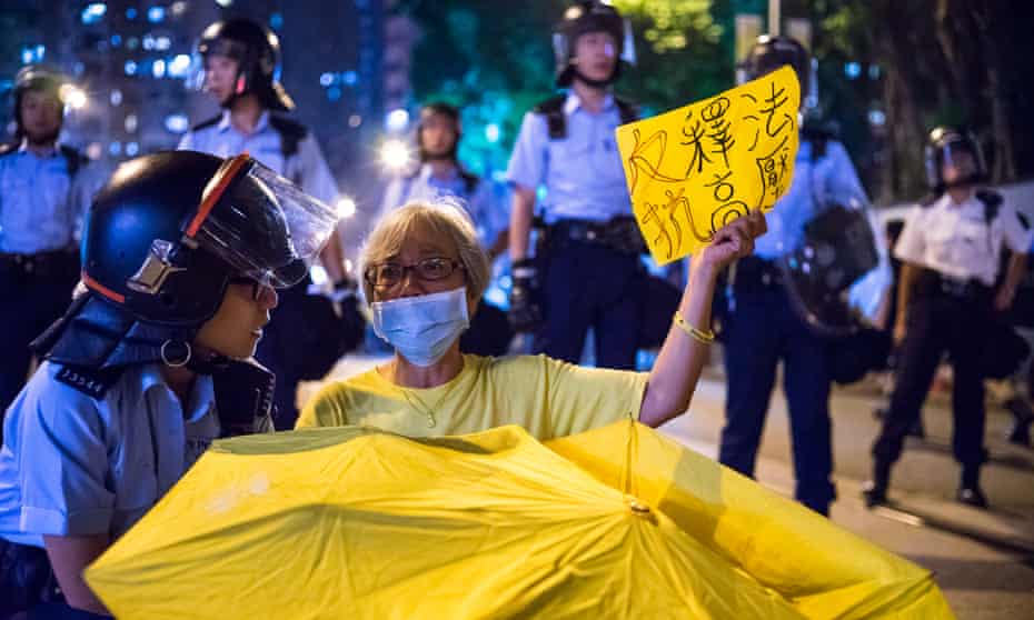 Protesters clash with police at China Liaison Office, where they occupied the road and were pepper sprayed.