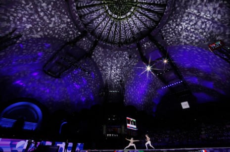 Manon Apithy-Brunet of France (right) on her way to victory against Sara Balzer of France in the gold medal fight in the women’s individual fencing sabre event at Le Grand Palais.