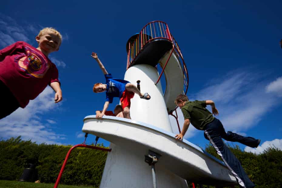 Young boys playing on the popular helter-skelter in the site’s playground