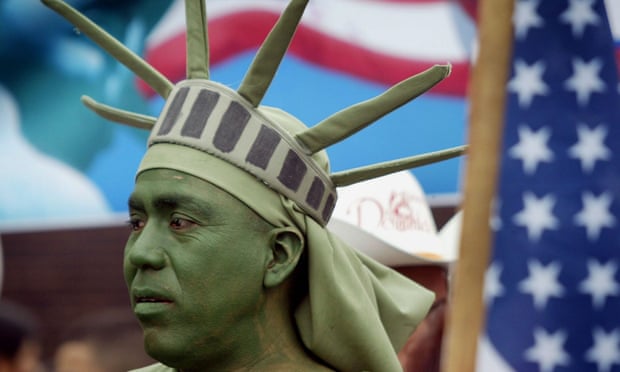 Person dressed as the Statue of Liberty participates in an immigrant rights march in May 2006 in Chicago