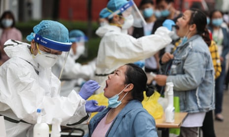 Open-air coronavirus testing gets under way in Wuhan, Hubei province.