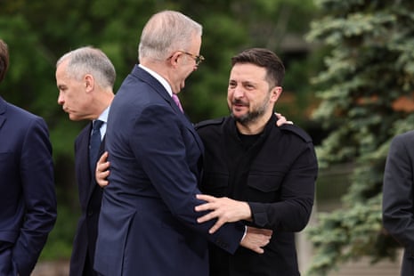 President of Ukraine, Volodymyr Zelenskyy (right), is embraced by Anthony Albanese during the G7 summit in Kananaskis, Canada.