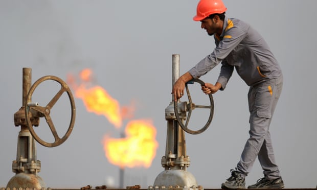 An Iraqi labourer works at an oil refinery