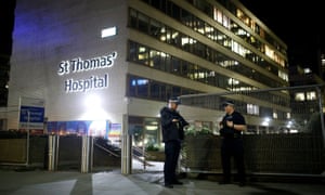 Police officers outside St Thomas’ hospital after Boris Johnson was moved to intensive care.