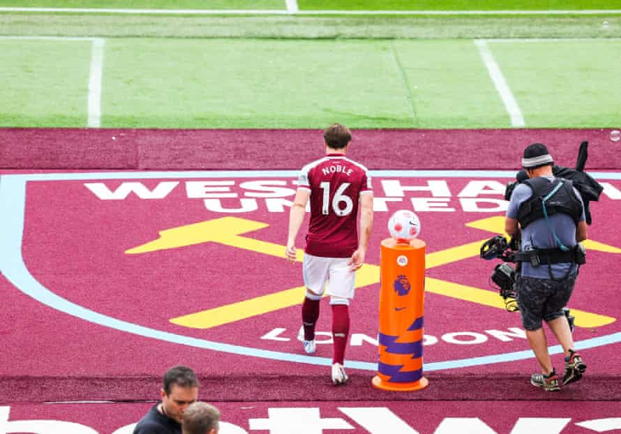 Mark Noble of West Ham United comes out at the start of his last game.