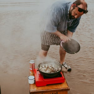 Chef Charlie Hodson cooking on a sandbank off the Norfolk coast.