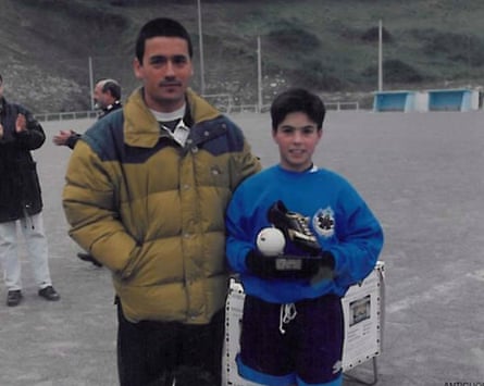 A young Mikel Arteta holding a football trophy