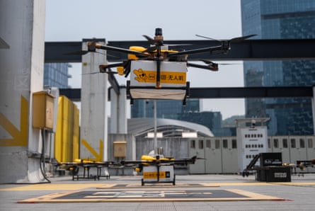 A drone operated by Meituan, loaded up with goods, takes off from a rooftop of a shopping on April 03, 2025 in Shenzhen, China.