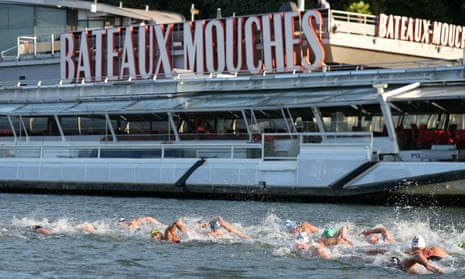 Athletes swim in the Seine during the men's 10km marathon swimming at the Paris 2024 Olympics.
