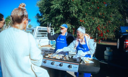 Charlton Lions Club members at a grill serving breakfast to bleary-eyed passengers