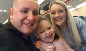 Sophia Gibson with her parents, Darren and Danielle.