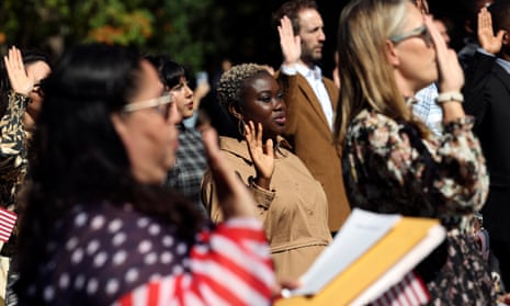 Newly naturalized citizens take the oath of allegiance during a naturalization ceremony at George Washington's Mount Vernon estate on September 23, 2022 in Mount Vernon, Virginia. 