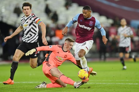 Sébastien Haller takes the ball past Dean Henderson of Manchester United during his time at West Ham