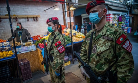Military police officers patrol a market in Budapest, Hungary