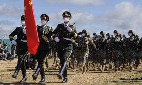 Chinese troops march during the Vostok 2022 military exercise at a firing range in Russia's far east.