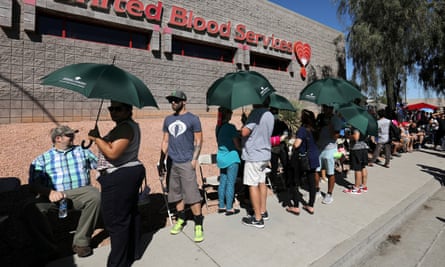 Hundreds of people queue to donate blood following the mass shooting at the Route 91 music festival.