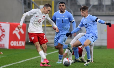 Dominik Marczuk (left) of Poland and Israel’s Ethan Azoulay (centre) and Adi Yona (right) in action during the European U21 qualifier.