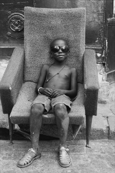 From Series: La Goutte d’Or, Paris – Mamadou has chosen his armchair on Rue Polonceau, 1982In the Goute d’Or neighbourhood, Martine Barrat met Mamadou Yaffa, then four years old, with whom she formed a very close friendship and whom she watched grow up through her lens. When Mamadou Yaffa was a teenager in the 1990s, Barrat invited him for a three-month visit to New York so he could experience the social reality of American life. In this way, she built a human bridge between two worlds she knew and loved. Nowadays, Mamadou Yaffa serves as deputy mayor of Paris