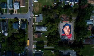 A mural of Breonna Taylor, who was killed in her own apartment by Louisville police officers, made on two basketball courts in Annapolis, Maryland, US