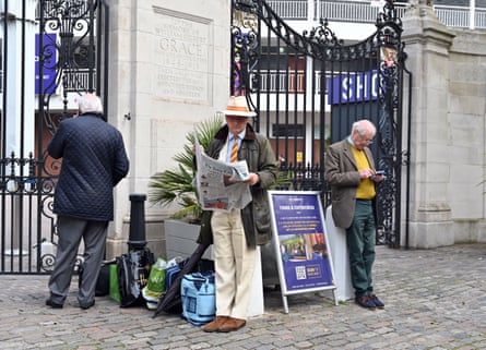 MCC members wait at the Grace gate outside Lord’s ahead of the Eton v Harrow cricket match at Lord’s Cricket Ground in London on 12 May 2023.