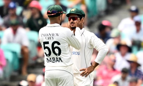 Babar Azam consoles Pakistan teammate Saim Ayub after he dropped a catch off Australia opener David Warner