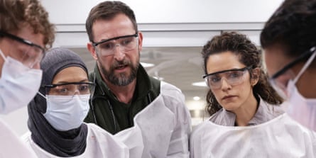 medics looking concerned and wearing eye protection