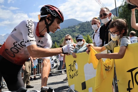 Cofidis rider Guillaume Martin signs a shirt for a young fan ahead of today’s stage.