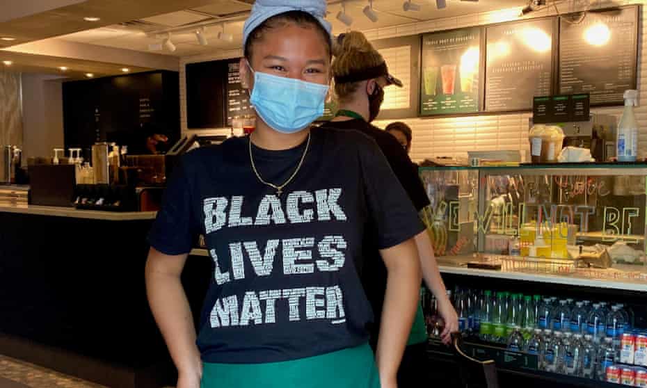 An mployee at Starbucks at the corner of Black Lives Matter Plaza, in Washington DC on 13 June.