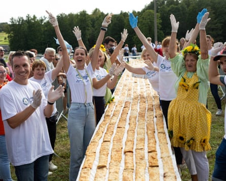 People celebrate after making the world’s biggest strudel