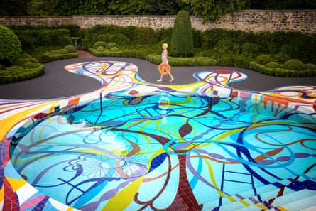 A wiggly-shaped, brightly coloured swimming pool