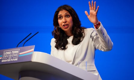 Suella Braverman at a podium gesturing as she gives a speech
