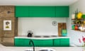 ‘The green harmonises with the surrounding countryside’: a shot of colour in the updated kitchen.