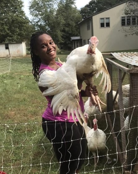 Johnson at her homestead in North Carolina, holding one of the 120 turkeys she raised for the holiday season.
