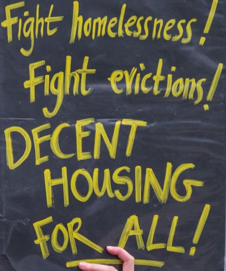 A placard calling for decent housing for all