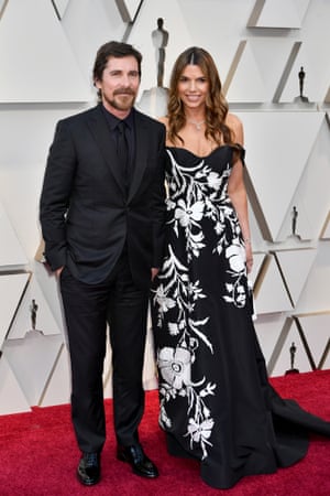 Nominated for his portrayal of Dick Cheney in Vice, Christian Bale looked sleeker and very far away from Washington's stuffy corridors of power on the Oscars red carpet. His black suit, shirt, tie and waistcoat is a classic take on monotoning – and works as the perfect counterpoint to his wife's Sibi Blazic's black and white dress