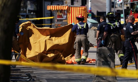 Emergency workers at the scene in Toronto, where a van struck multiple people.