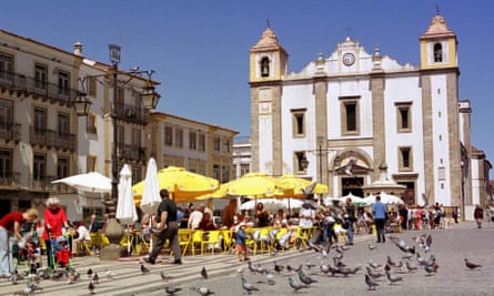 People having their morning coffee in the historic center of Évora, in the Alentejo region of Portugal.