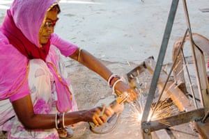 A women welding joints during the construction of a solar cooker at the Barefoot College in Tilonia, Rajasthan, India