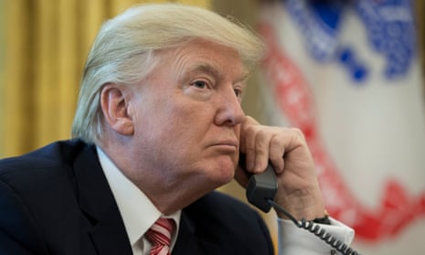Donald Trump makes a phone call in the Oval Office.