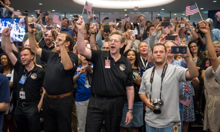 New Horizons team members count down to the spacecraft’s closest approach to Pluto in July 2015.