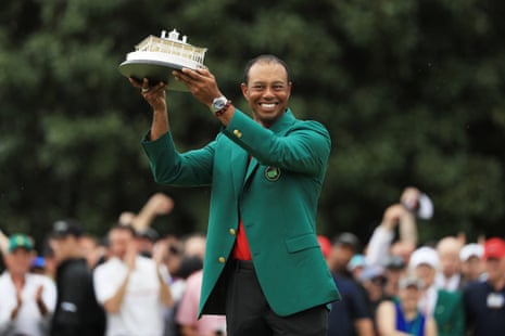 Tiger Woods celebrates with the Masters Trophy.