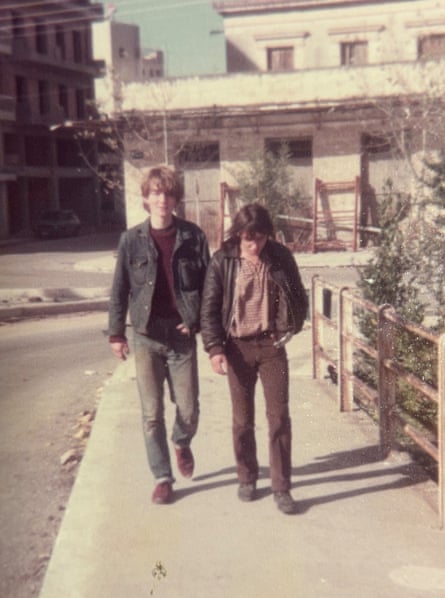 A faded photo of two young men walking down a street