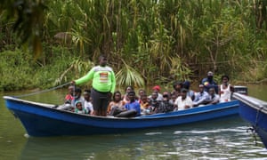 Migrants, mostly Haitians, arriving by boat in Acandi in Colombia to cross into Panama ready to continue north, on September 23, 2021.