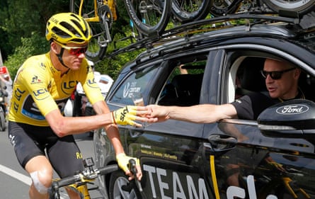 Chris Froome takes a glass of champagne from Sir Dave Brailsford during the 2016 Tour de France.