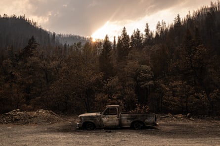 A burned out pickup truck among a scorched forest in Happy Camp.